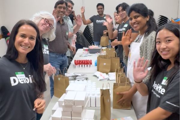 A company team volunteering together at an Artly World event.