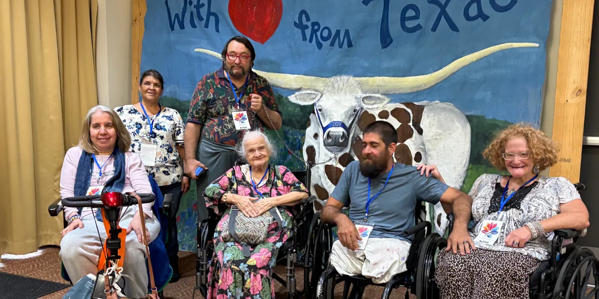 Guests viewing community-created artwork at an Artly World public art exhibition in Austin, Texas