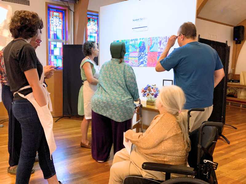Joyful seniors painting together at an Artly World Joy for Seniors art workshop in Austin, Texas