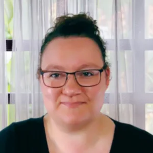 Myranda Harris, Program Director of Artly World, in a professional portrait.