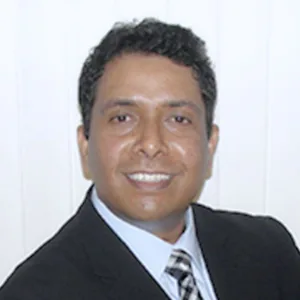 Roshan Manjunath, Executive Director of Artly World, in a professional portrait.